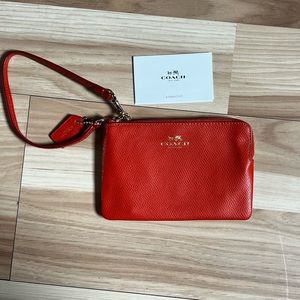 Orange COACH Wristlet